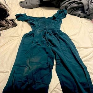 Green jump suit with tie back